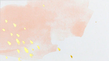 peach blush watercolor placecards with a few shimmering gold splatter designs