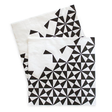 Paper Eskimo Napkin has white base with black geo print on 3/4 of the napkin